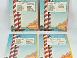 three books with a picture of a lighthouse on the cover