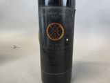 a bottle of wine that is sitting on a table