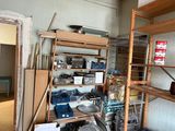 a room that has a bunch of items on the shelves
