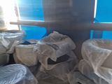 many bags of toilet paper on the floor in the room