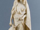 statue of a woman holding a pot and a jug