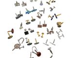 many different types of screws and bolts on a white surface