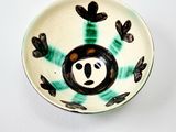 a small bowl with a panda face on it