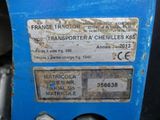 a close up of a blue machine with a label on it