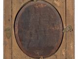 an old wooden box with a label on it with a number on it