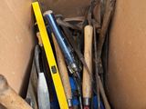 a cardboard box full of tools and tools in it