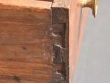 a close up of a piece of wood with a screw in it