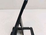 a black tablet computer sitting on top of a stand