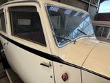 a white car that is parked in a garage