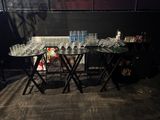 a table with a lot of empty glasses on it