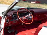 a red and white car with a red leather seat and dashboard