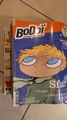 a magazine with a picture of a boy on the cover
