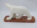 marble sculpture of a polar bear on a marble base