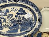 a blue and white plate with a picture on it