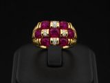 an 18k yellow gold ring set with ruby and diamonds