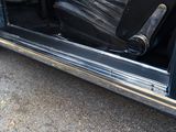 a black car with a black seat and a black seat cover