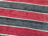 an image of a red and black striped rug with white and red stripes