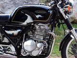 a motorcycle that is parked on the side of the road