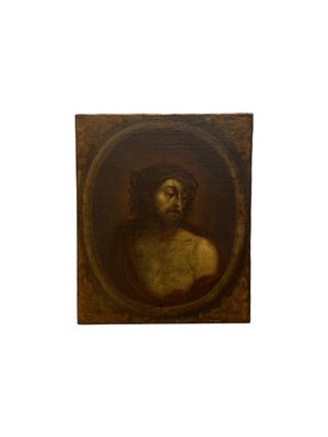 portrait of a bearded man in a round frame