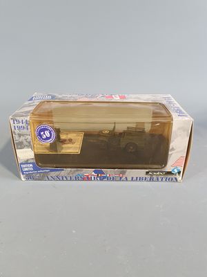 a box with a toy truck in it on a table