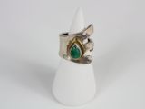 silver and gold ring with a green tear