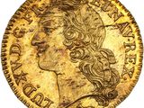 une pièce d'or représentant la tête d'une femme aux cheveux longs