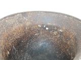 a close up of a metal bowl on a table