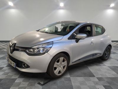 the silver car is parked on a checkered tile floor