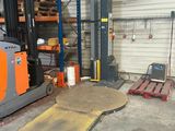 a forklift that is parked in a warehouse