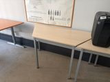 two desks with a printer on top of them