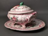 a white and pink bowl and saucer on a plate
