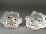 pair of clear glass flower dishes with holes in the center