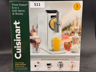 emballage d'une boîte sur laquelle figure l'image d'un extracteur de jus