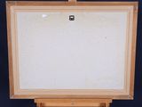 an easel with a white board on a black background