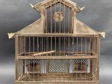 a bird cage with a bird inside of it