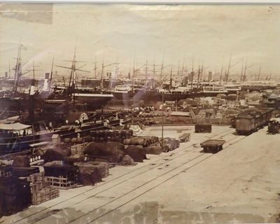 an old photo of a harbor filled with ships