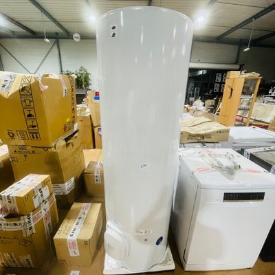 a white refrigerator and a white washing machine in a warehouse