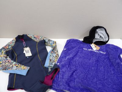 two jackets and a hat are sitting on a white table