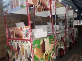a food cart that has a lot of food on it