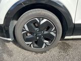 a close up of a tire on a white car