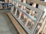a large window that is on a pallet in a garage
