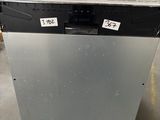an old dishwasher sitting on a pallet in a warehouse