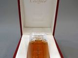 an image of a bottle of cologne in a red box