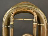 a brass instrument that is sitting on top of a table