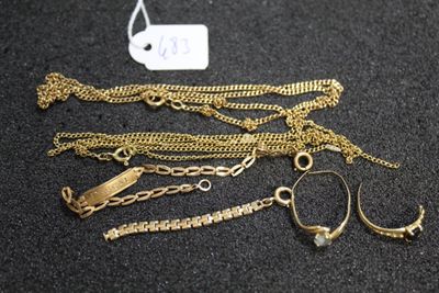 a lot of gold chains and bracelets on a table