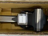 a box with a computer inside of it on the floor
