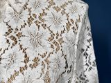 a close up of a white lace dress on a mannequin mannequin mannequin mannequin mannequin mannequin mannequin mann