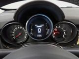 a close up of a car dashboard with a speedometer and gauges