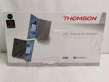 a box with a laptop inside of it on a white surface