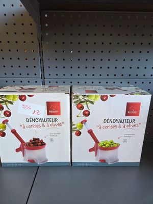 two boxes of food sitting on a shelf in a store